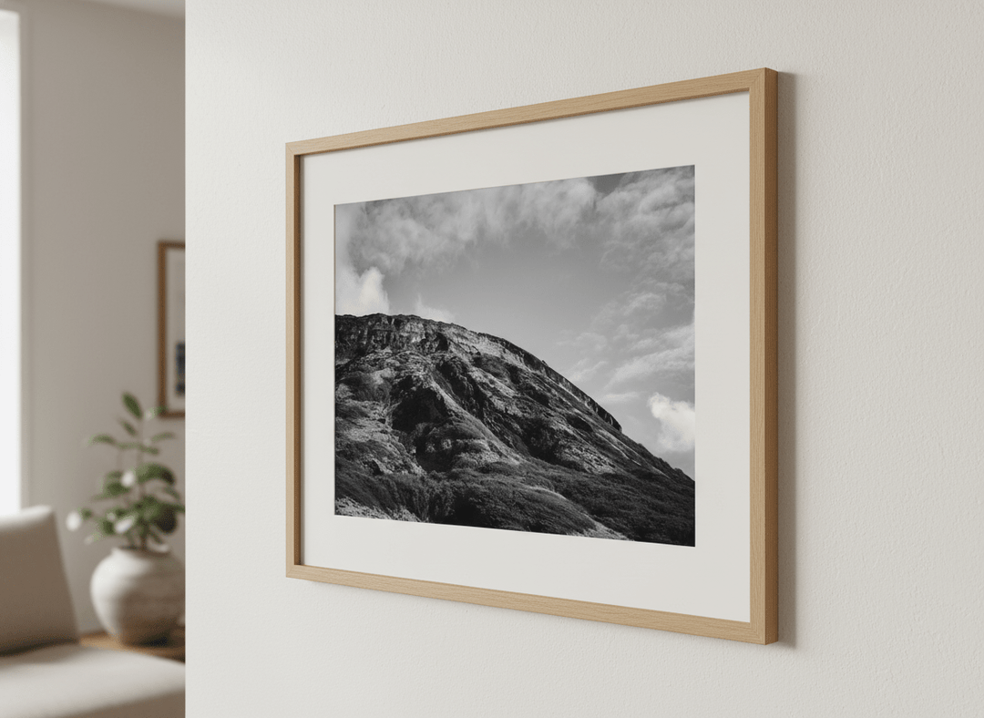 Modern wall art styled above a sofa in a neutral living room