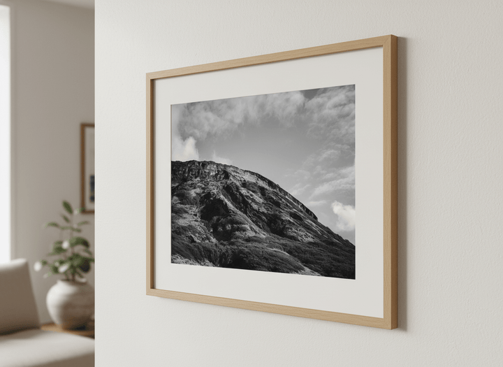 Modern wall art styled above a sofa in a neutral living room