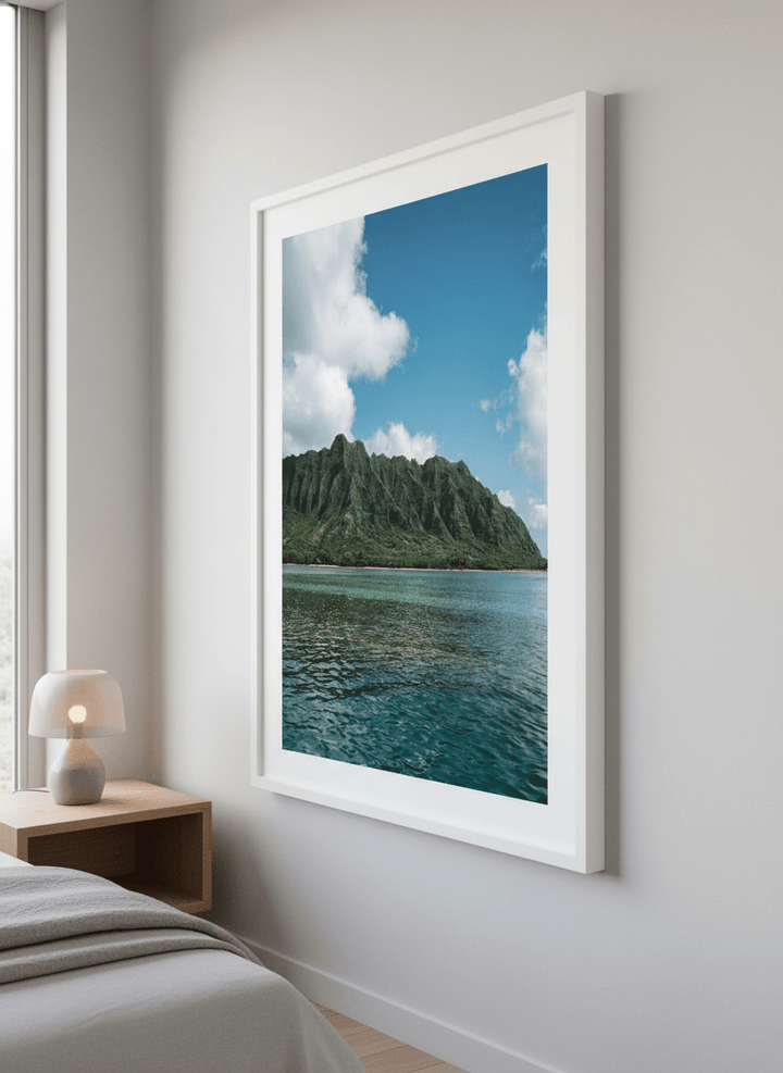 Minimalist artwork displayed in a calm, light-filled bedroom interior