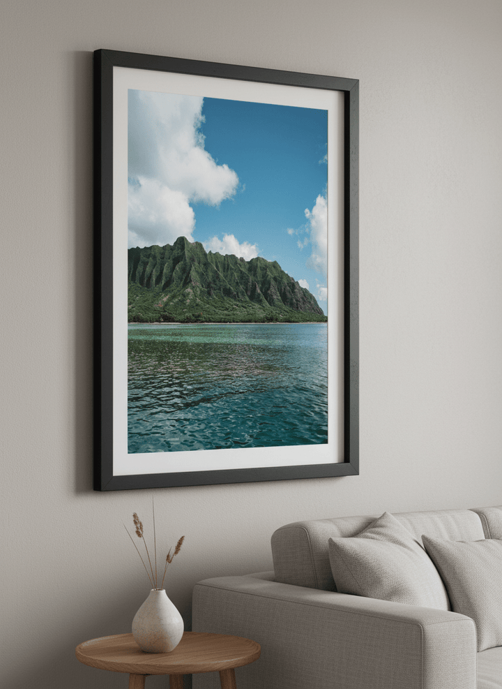 Modern wall art styled above a sofa in a neutral living room