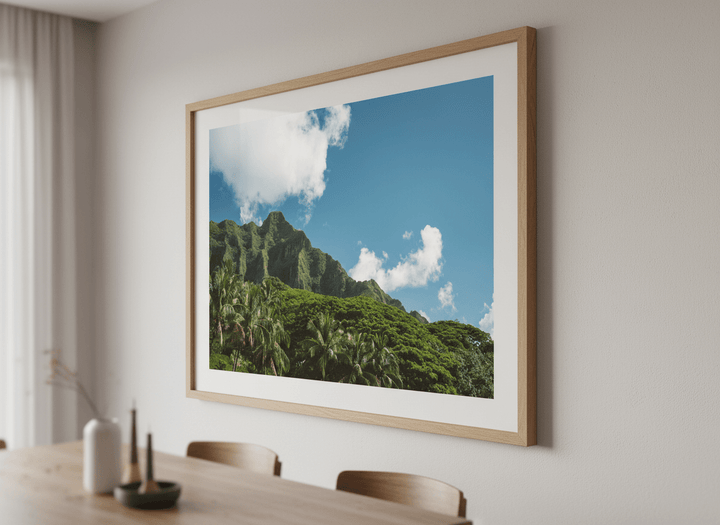 Wall art styled above a dining table in a contemporary home