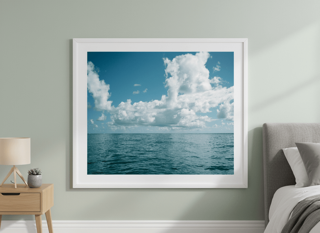 Minimalist artwork displayed in a calm, light-filled bedroom interior