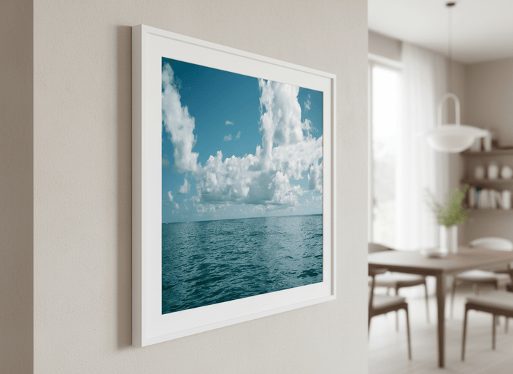 Wall art styled above a dining table in a contemporary home