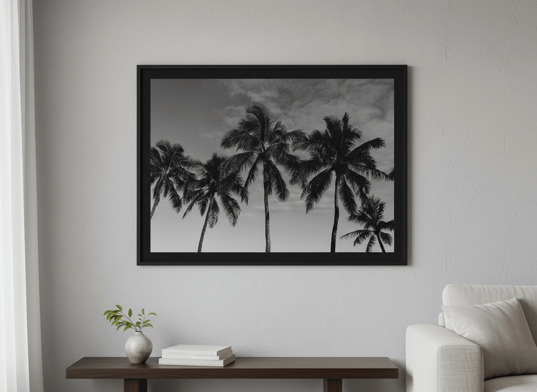 Modern wall art styled above a sofa in a neutral living room