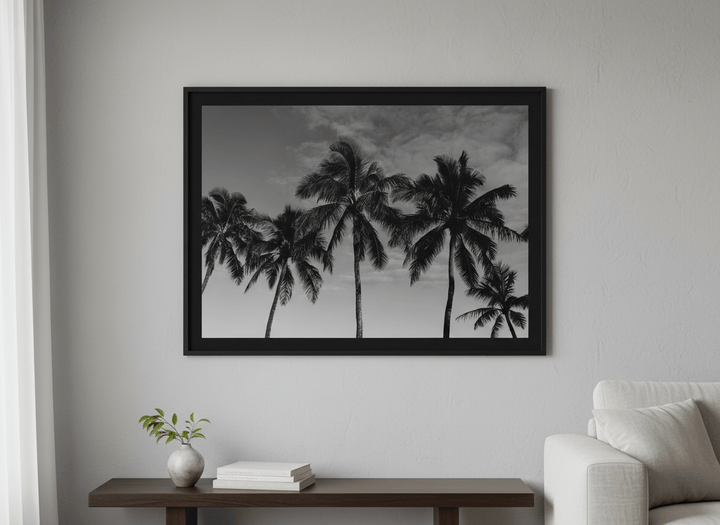 Modern wall art styled above a sofa in a neutral living room