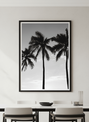 Wall art styled above a dining table in a contemporary home