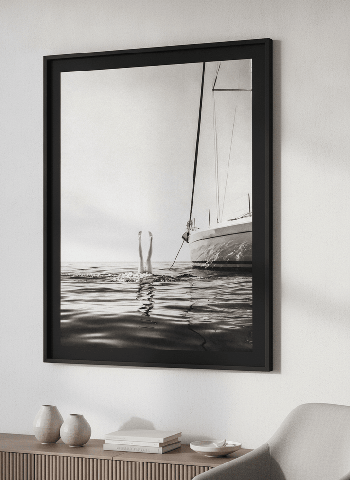 Modern wall art styled above a sofa in a neutral living room