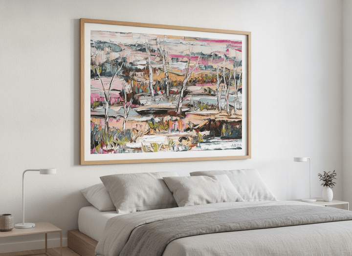 Minimalist artwork displayed in a calm, light-filled bedroom interior