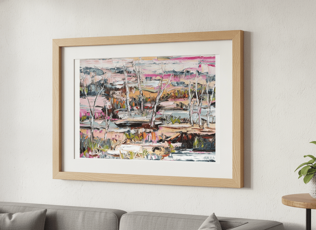 Modern wall art styled above a sofa in a neutral living room