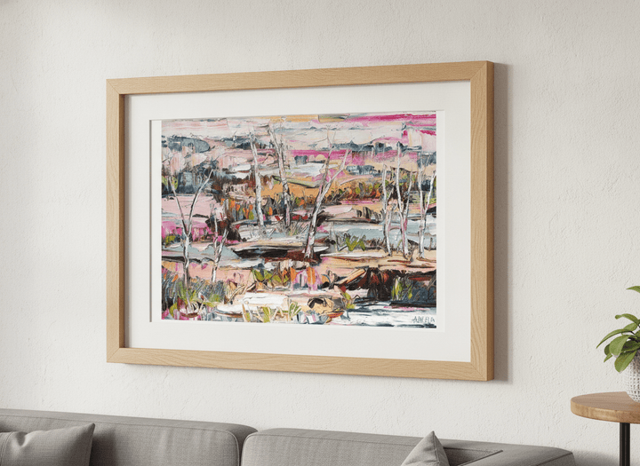 Modern wall art styled above a sofa in a neutral living room