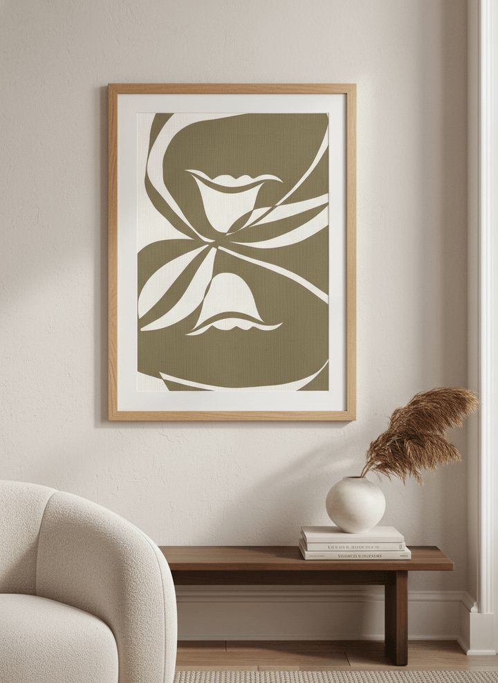 Modern wall art styled above a sofa in a neutral living room