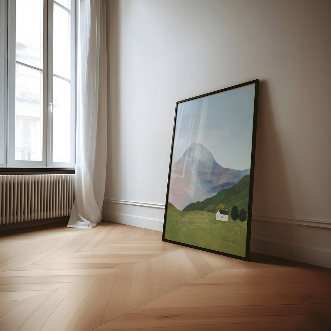 Artwork on wooden floor leaning against wall