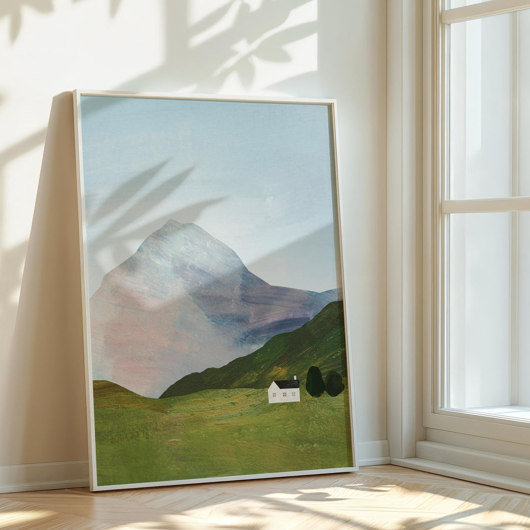 artwork of a mountain landscape in a bright room with sunlight casting shadows.