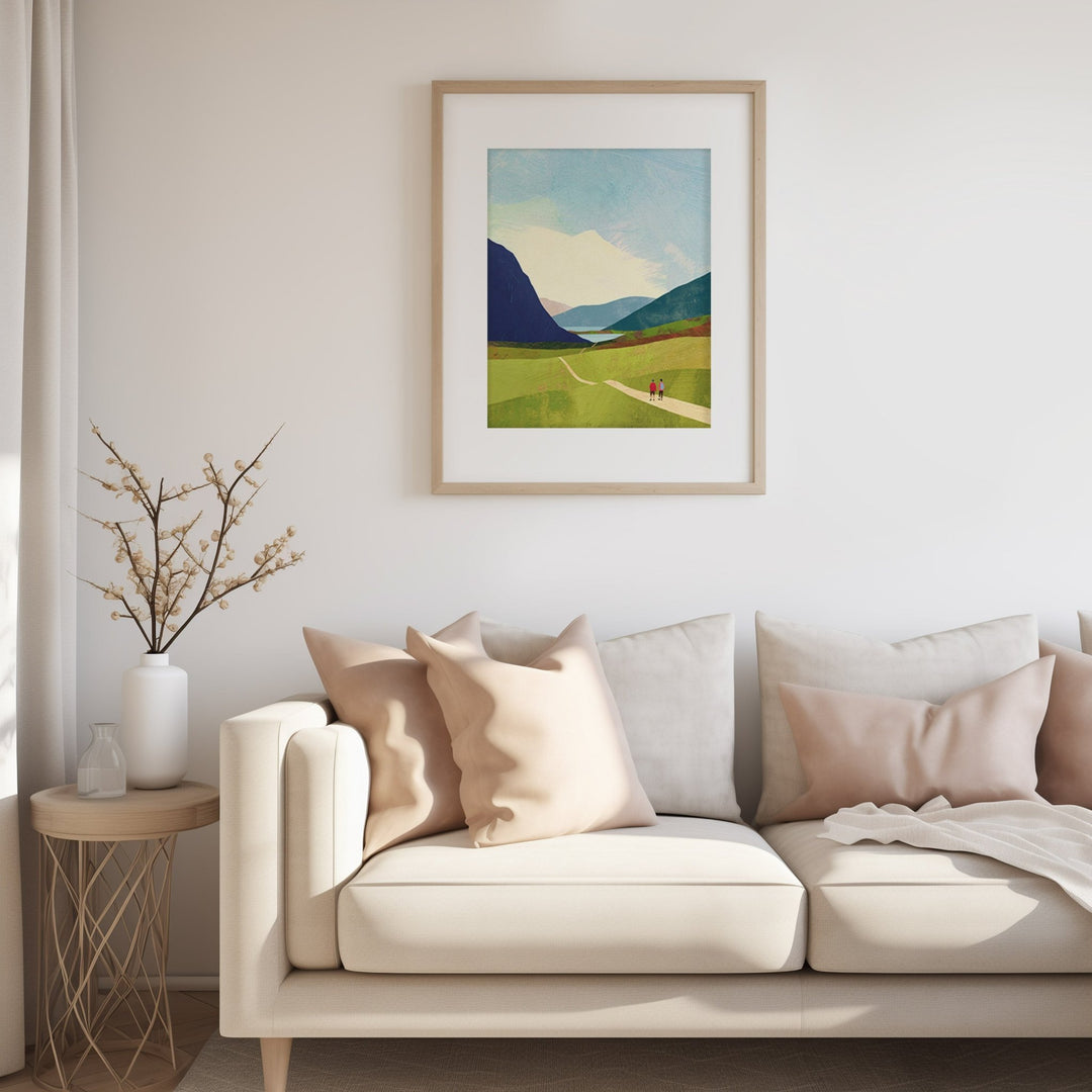 Living room with a beige sofa, decorative pillows, and a landscape painting on the wall.