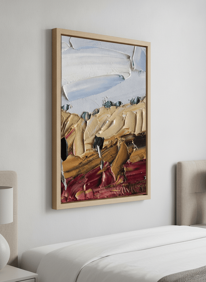 Minimalist artwork displayed in a calm, light-filled bedroom interior