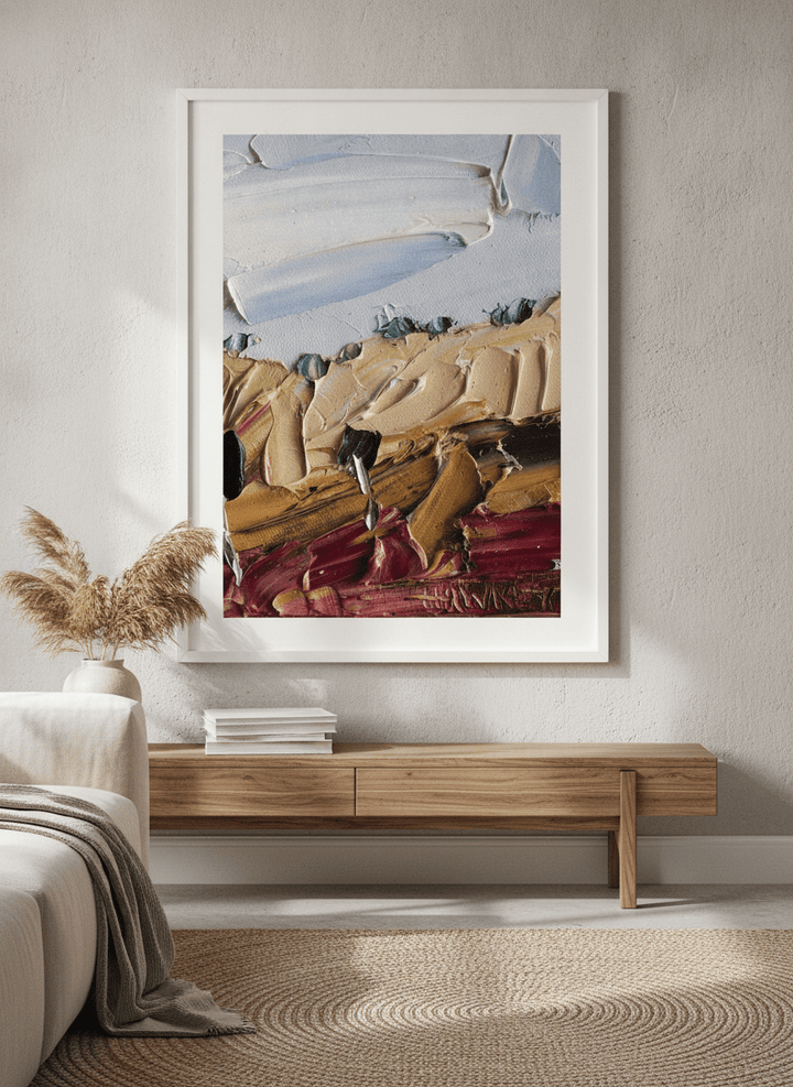 Modern wall art styled above a sofa in a neutral living room
