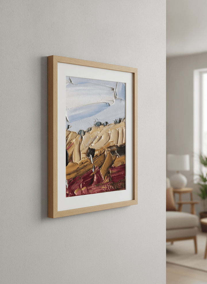Modern wall art styled above a sofa in a neutral living room