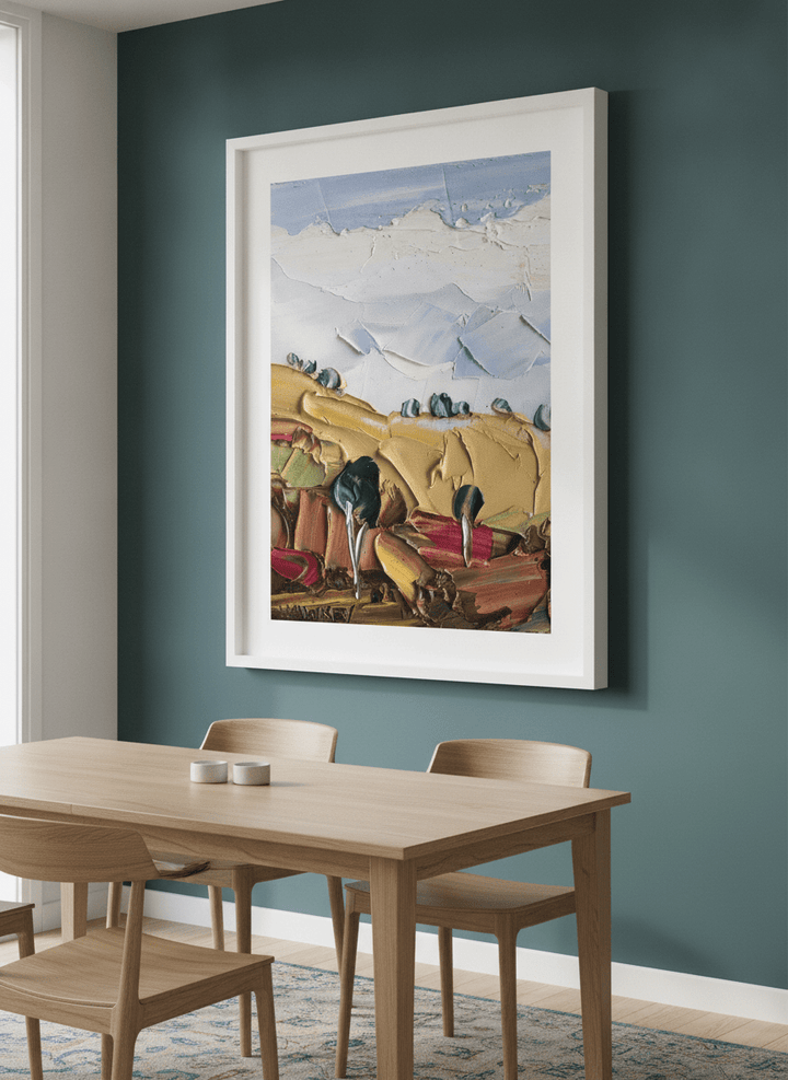 Wall art styled above a dining table in a contemporary home