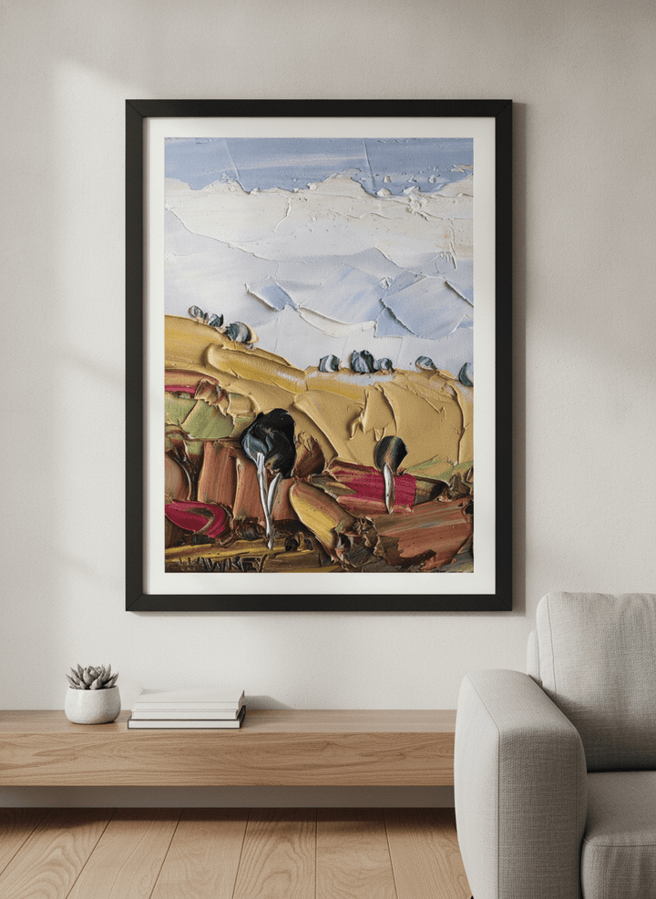 Modern wall art styled above a sofa in a neutral living room