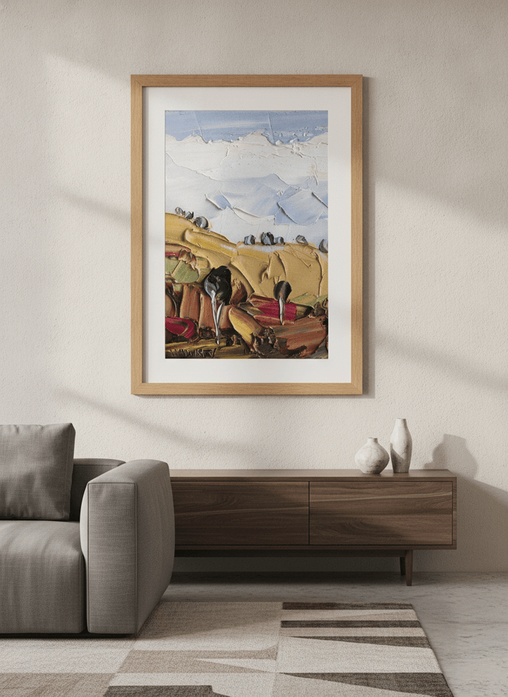 Modern wall art styled above a sofa in a neutral living room