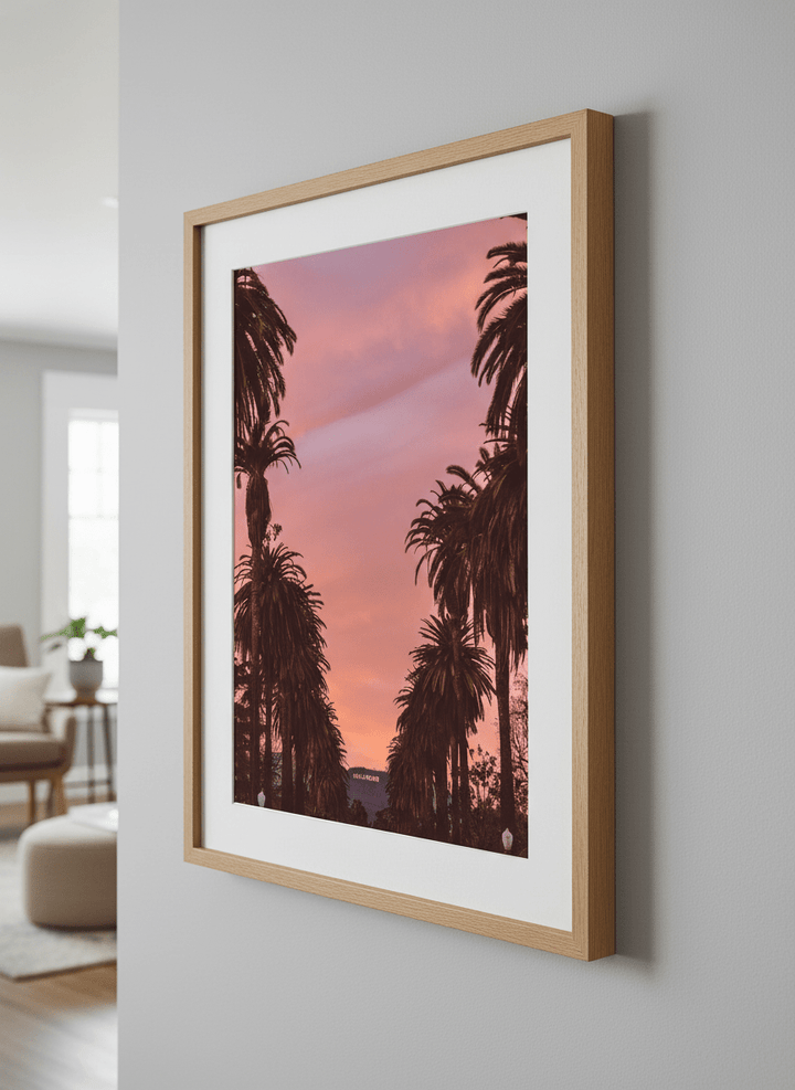 Modern wall art styled above a sofa in a neutral living room