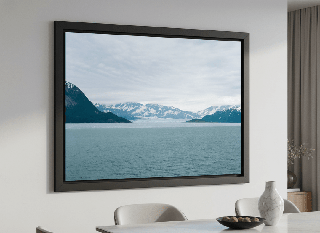 Wall art styled above a dining table in a contemporary home