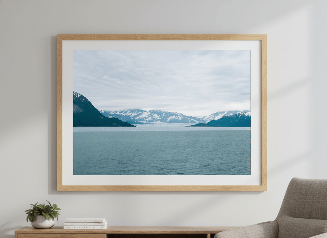 Modern wall art styled above a sofa in a neutral living room