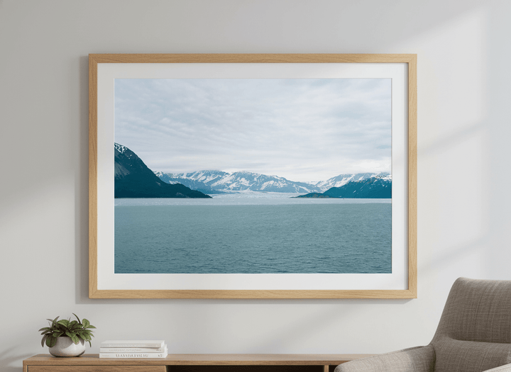 Modern wall art styled above a sofa in a neutral living room