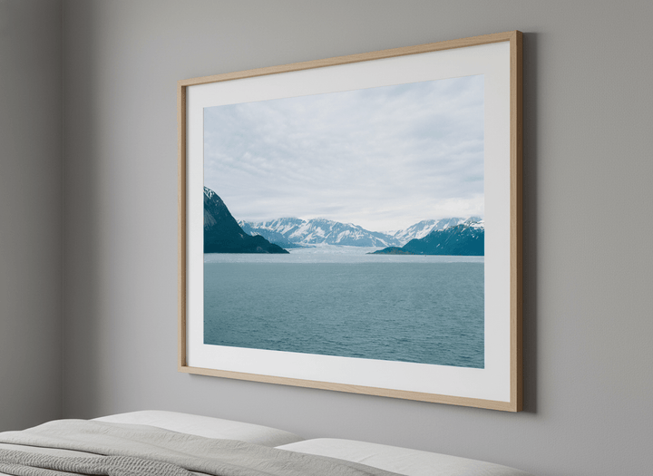 Minimalist artwork displayed in a calm, light-filled bedroom interior