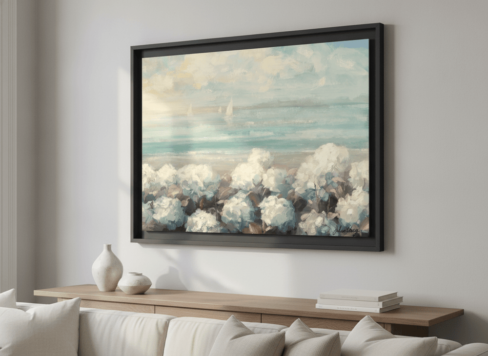 Modern wall art styled above a sofa in a neutral living room