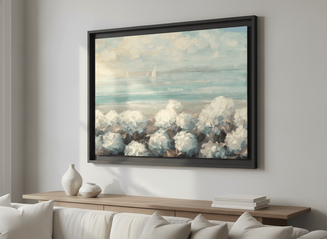 Modern wall art styled above a sofa in a neutral living room