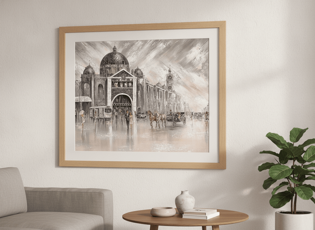 Modern wall art styled above a sofa in a neutral living room