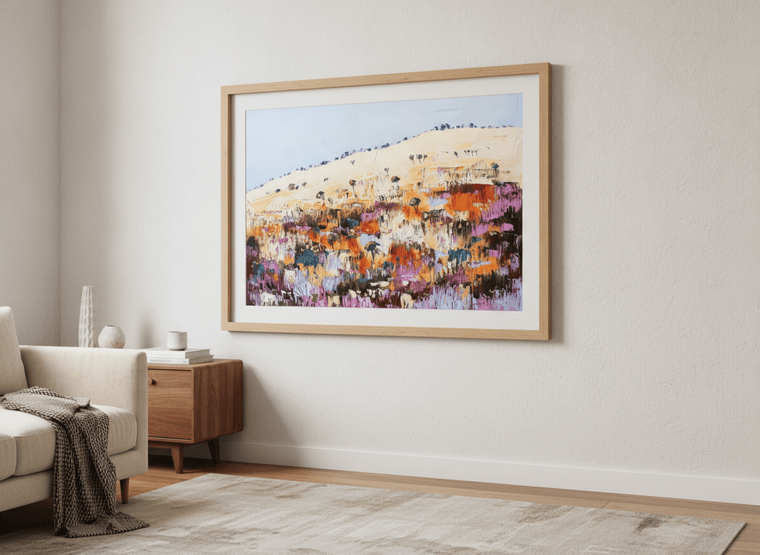 Modern wall art styled above a sofa in a neutral living room