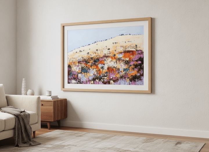 Modern wall art styled above a sofa in a neutral living room