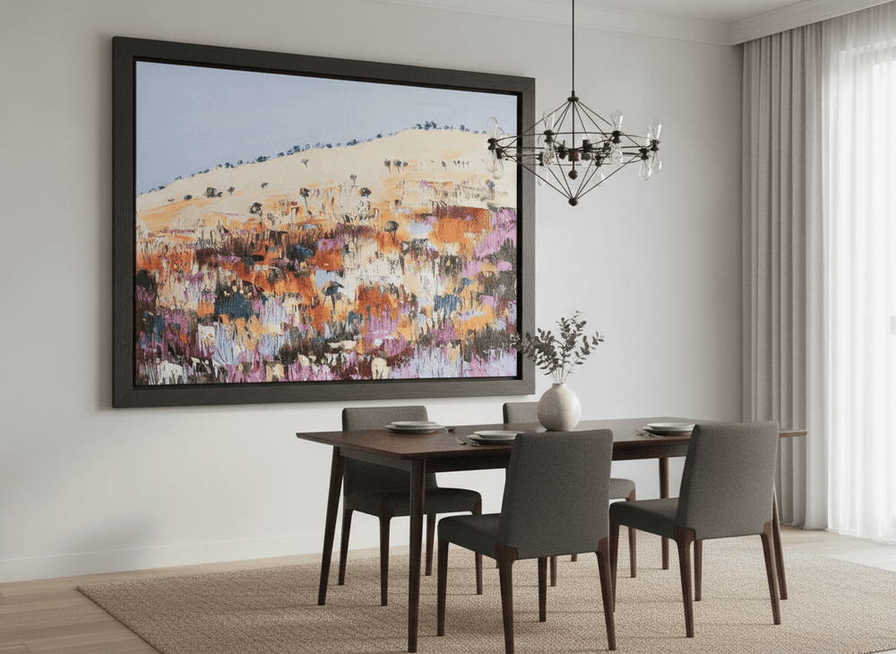 Wall art styled above a dining table in a contemporary home