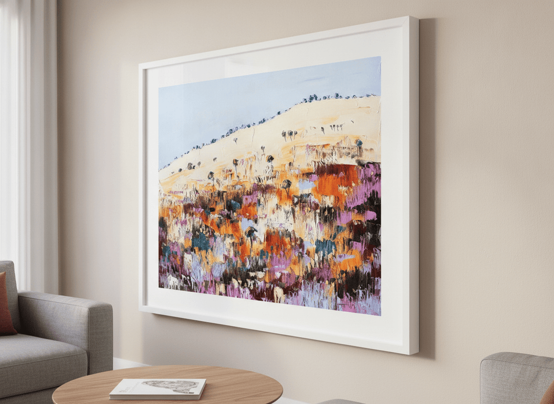 Modern wall art styled above a sofa in a neutral living room