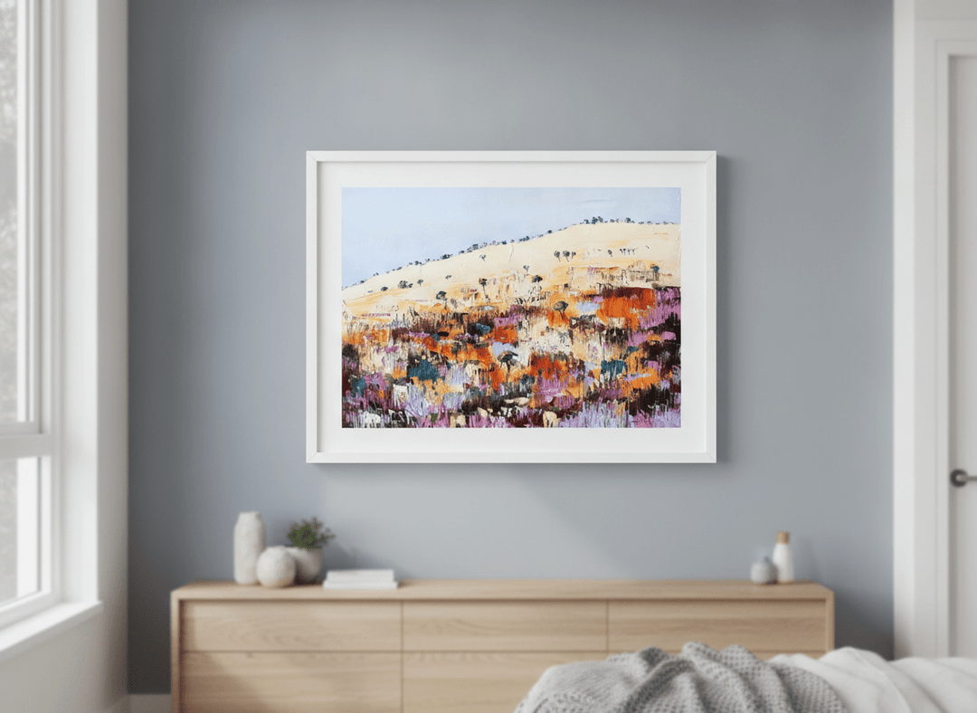 Minimalist artwork displayed in a calm, light-filled bedroom interior