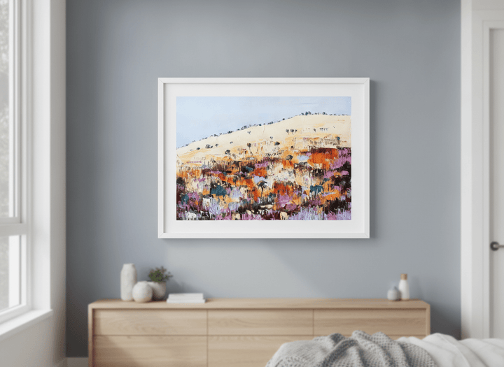 Minimalist artwork displayed in a calm, light-filled bedroom interior