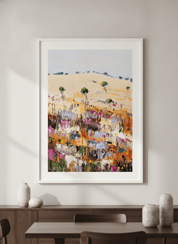 Wall art styled above a dining table in a contemporary home
