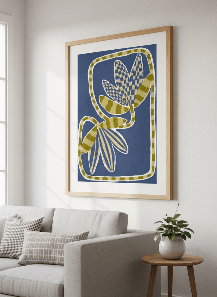 Modern wall art styled above a sofa in a neutral living room