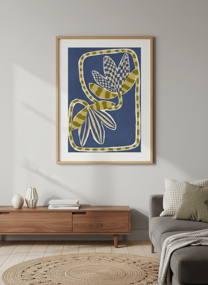 Modern wall art styled above a sofa in a neutral living room