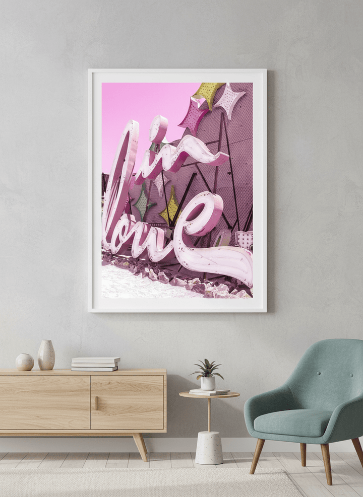 Modern wall art styled above a sofa in a neutral living room