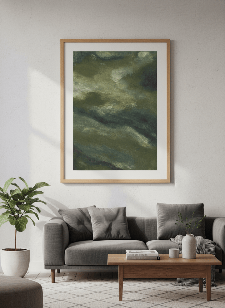 Modern wall art styled above a sofa in a neutral living room