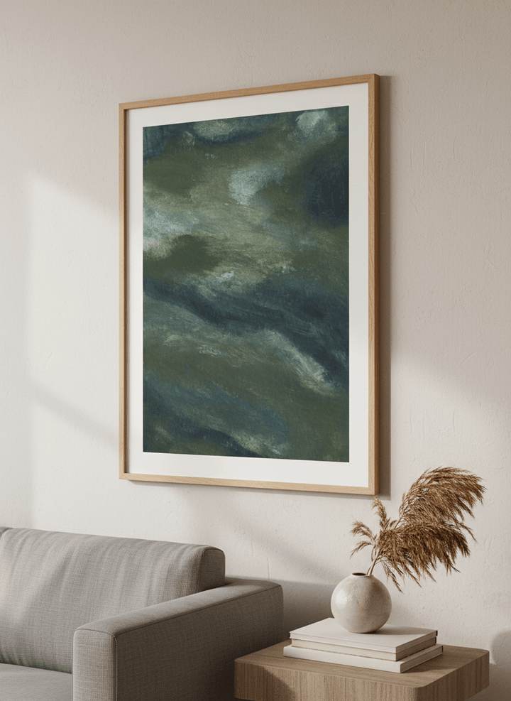 Modern wall art styled above a sofa in a neutral living room