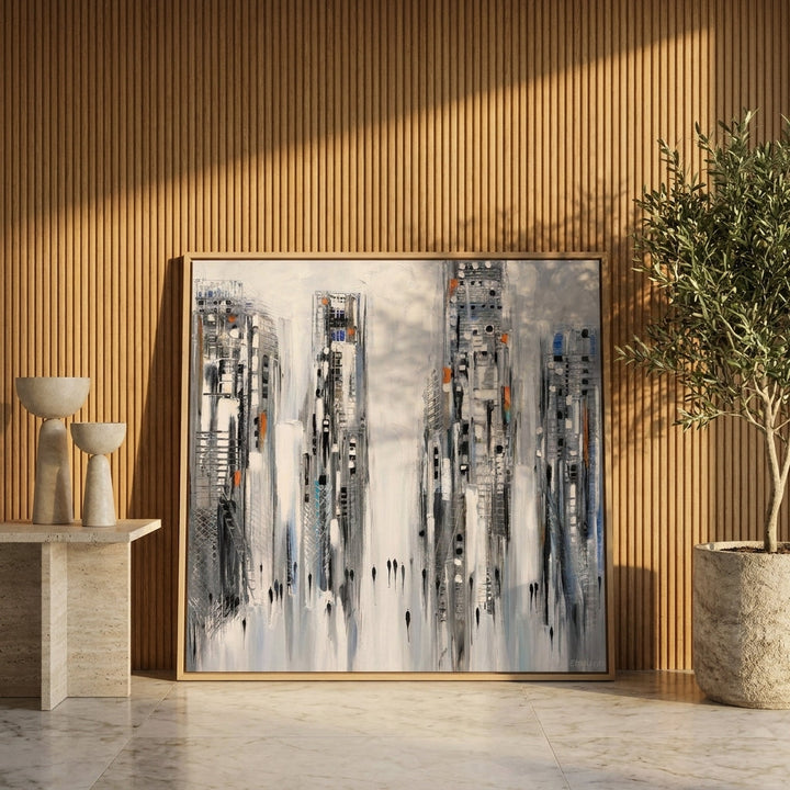 Canvas wall art with a natural timber surround leaning against the wall in a luxe home office