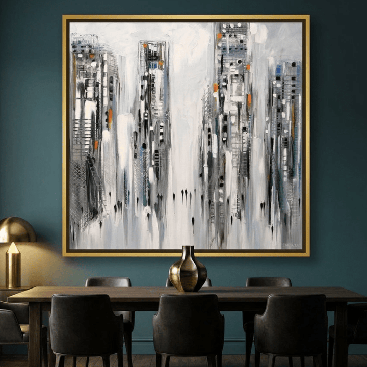 Oversized statement canvas wall art with a gold leaf surround styled on the wall in a moody dining room
