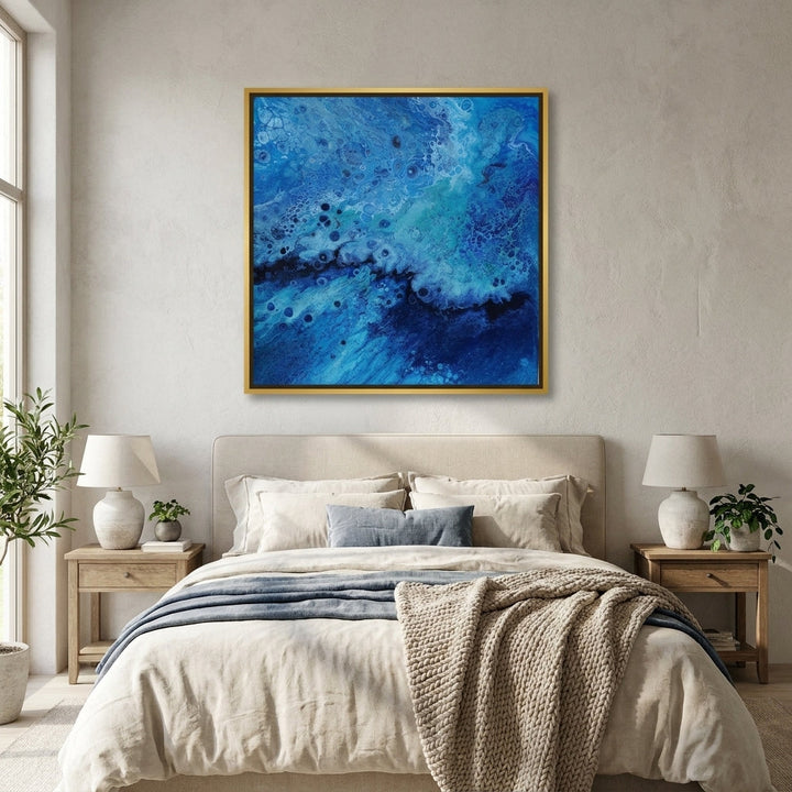 Canvas wall art with a gold leaf surround styled in a calm, light-filled bedroom