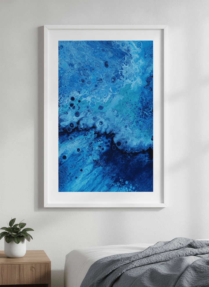 Minimalist artwork displayed in a calm, light-filled bedroom interior