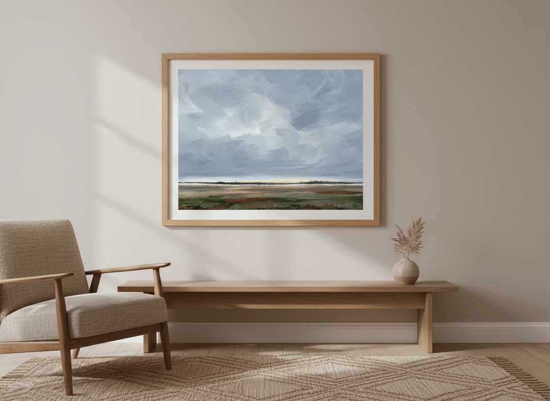 Modern wall art styled above a sofa in a neutral living room