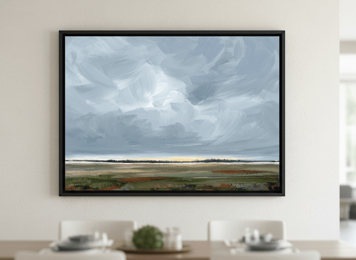 Wall art styled above a dining table in a contemporary home